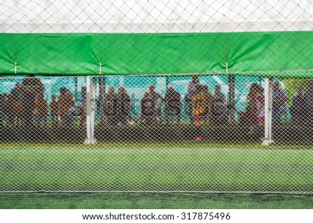 ストックフォト: Unrecognizable Audience Watching Kids Soccer Game