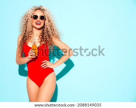 Stockfoto: Sexy Brunette In A Bright Red Bathing Suit