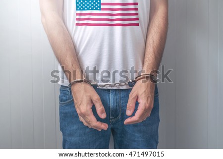 Stock foto: Arrested Man With Cuffed Hands Wearing Shirt With Usa Flag