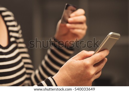 Foto stock: Woman Using Mobile Smart Phone To Load E Wallet Account