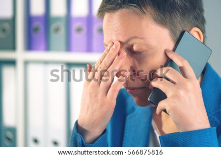 Stock photo: Forgetful Businesswoman During Mobile Phone Conversation