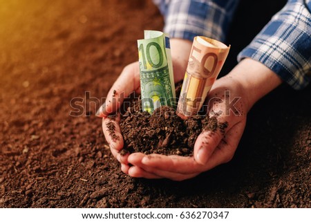 [[stock_photo]]: Hands With Fertile Soil And Euro Money Banknotes