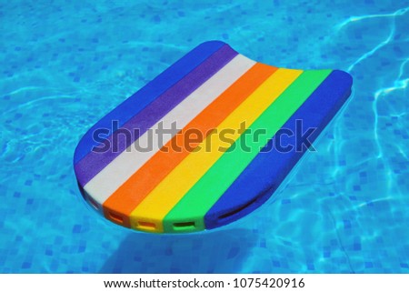 Сток-фото: Rainbow Pattern Styrofoam Swimming Board Baseboard Floating In P