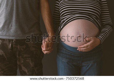 Сток-фото: Soldier And His Pregnant Wife Holding Hands