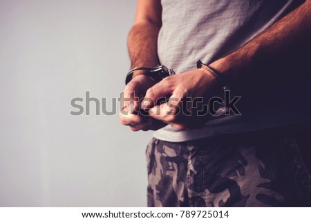 Foto d'archivio: Handcuffed Soldier In Military Army Clothes