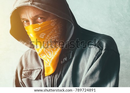 Stockfoto: Hooded Gang Member Criminal With Scarf Over Face