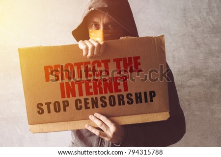 Foto stock: Hooded Activist Protestor Holding Protect The Internet Protest S