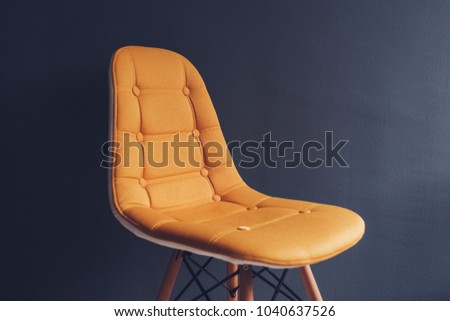 Stok fotoğraf: Empty Generic Yellow Chair Against Waiting Room Gray Wall