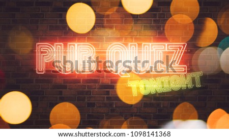 Foto stock: Pub Quiz Neon Sign Mounted On Brick Wall