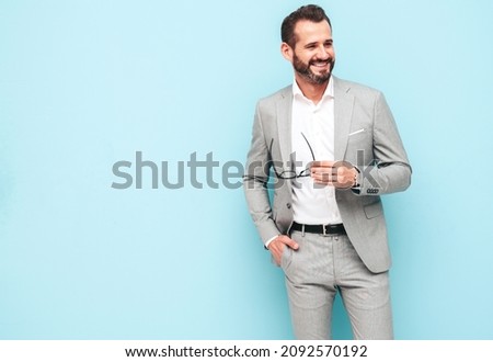 Stok fotoğraf: Sexy Man Standing By Wall Smiling