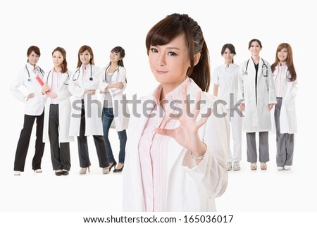 Friendly Asian Doctor Woman Give You An Okay Sign Closeup Portrait Isolated On White Background Foto d'archivio © elwynn