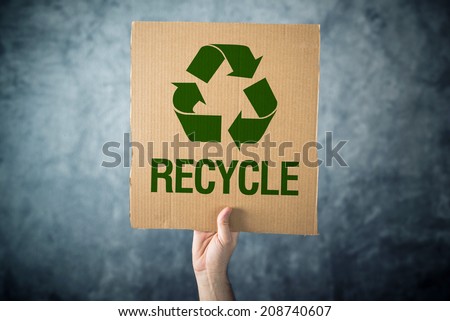 Zdjęcia stock: Recycle Man Holding Cardboard With Recycle Symbol Printed