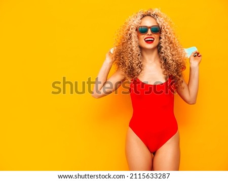 Foto stock: Tanned Sexy Brunette Posing In Yellow Swimsuit