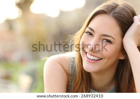 Zdjęcia stock: Young Beautiful Laughing Woman Looking Up At Copyspace Isolated On A White Background