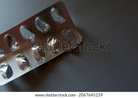 Foto stock: Cure For Epilepsy - Gray Pack Of Pills