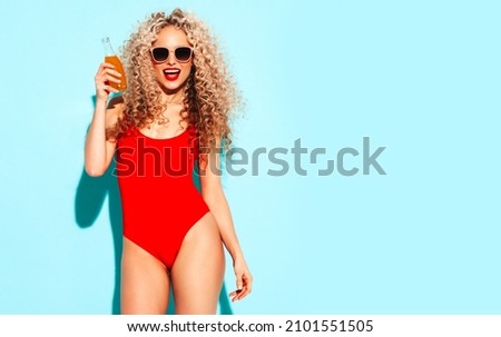 Stock photo: Sexy Blonde Lady In Red Swimsuit