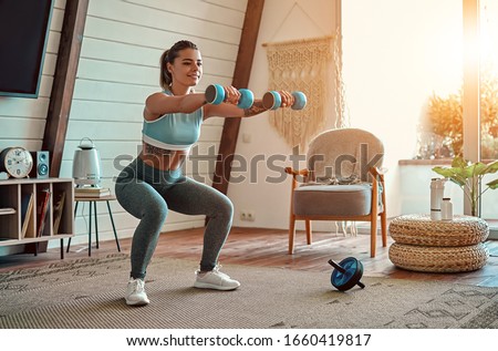 Сток-фото: Happy Athletic Woman With Dumbbells Doing Sport Exercise Isolat