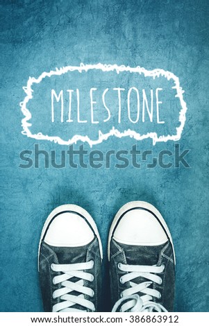 Stok fotoğraf: Young Man Standing On The Street Milestone Marking On Road