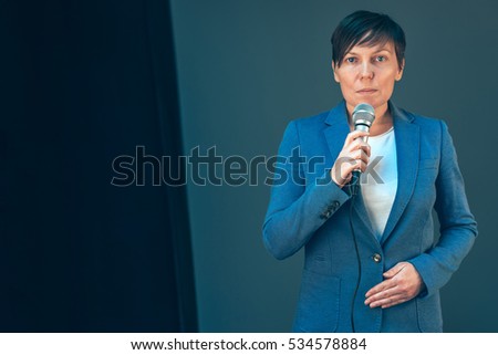 ストックフォト: Elegant Female Television Journalist Doing Business Reportage