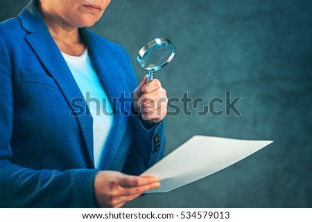 [[stock_photo]]: Female Lawyer Reading Legal Contract Agreement Disclaimer With M