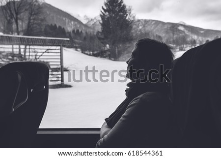 Сток-фото: Female Tourist On The Bus Riding Through Winter Landscape