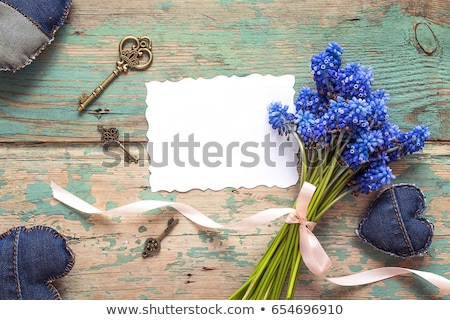 Сток-фото: Old Paper With Bunch Of Flower On The Blue Background