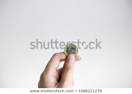 Zdjęcia stock: Hand Holding 1 Euro Coin