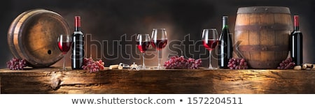 Foto d'archivio: Wine Barrels And Bottles In Cellar