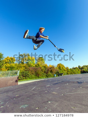 Stock photo: Boy With Scooter Is Going Airborne