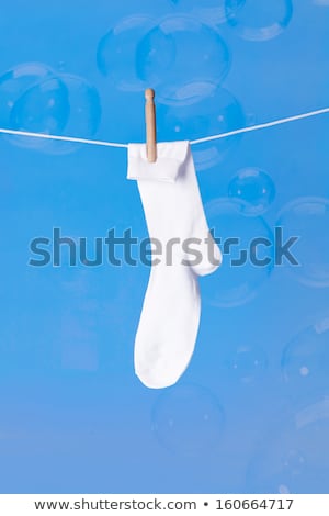 Stok fotoğraf: Wooden Dolly Pegs And Bubbles On White Background