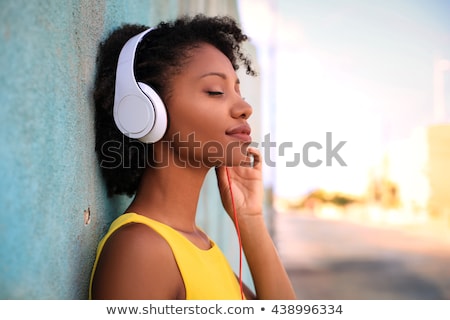 Stock fotó: Happy African Woman Listening To Music On Headphones