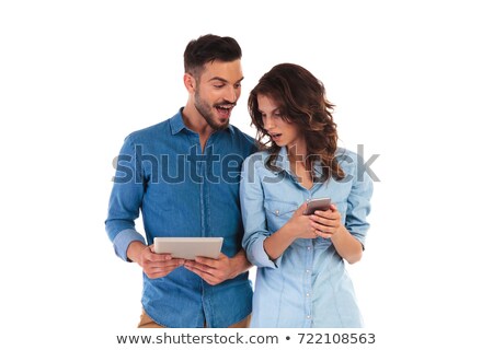 Zdjęcia stock: Surprised Casual Man Showing Good News To Girlfriend On Tablet