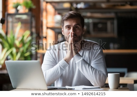 Zdjęcia stock: Nervous Young Man With Hopeful Gesture