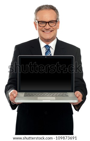 Businessman Holding An Open Laptop Isolated On White Background Foto stock © stockyimages