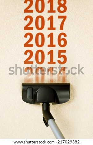 Stock photo: Vacuum Cleaner Sweeping Year Number 2014 From Carpet