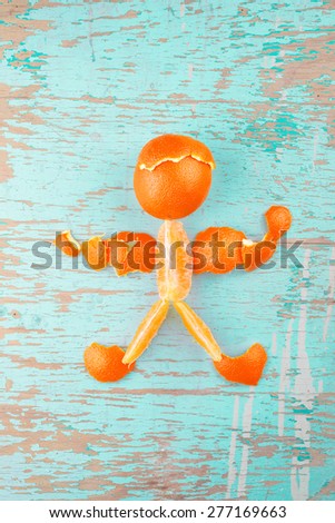 Stock photo: Human Figure Made Of Fresh Orange Slices And Peel