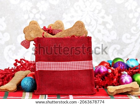 Stockfoto: Christmas Bag Filled With Homemade Bone Shaped Dog Biscuits