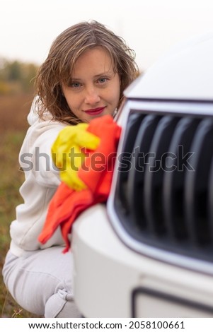 Stock fotó: Young Pretty Woman Washes Off Road Car