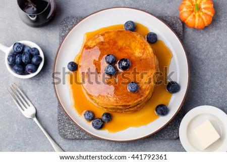 Foto stock: Pumpkin Pancakes With Maple Syrup And Blueberries On A Plate Grey Stone Background