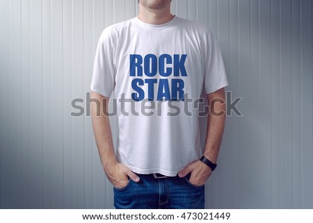 Stock fotó: Casual Adult Male Wearing T Shirt With Rock Star Title