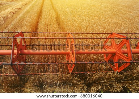 [[stock_photo]]: Combine Harvester Revolving Reel Harvesting Wheat Crops