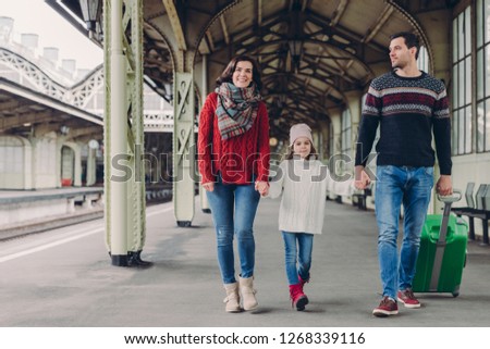 Stock photo: Happy Brunette Woman Wears Red Sweater And Scarf Small Kid In Oversized Jumper Handsome Man Carrie