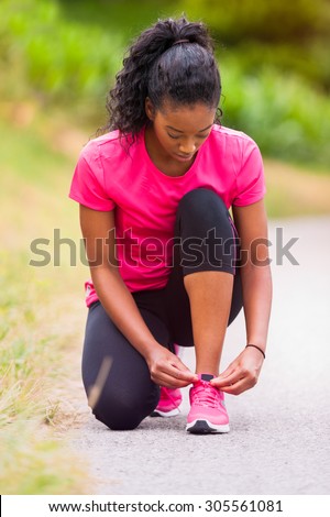 Stock photo: African American Woman Runner Tightening Shoe Lace - Fitness Pe
