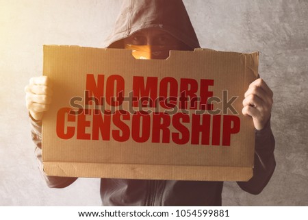 Stock foto: Hooded Activist Protestor Holding No More Censorship Protest Sig