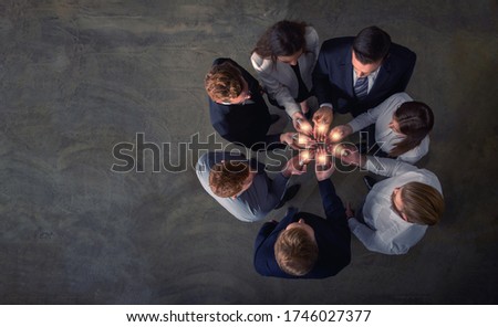 Stock photo: Teamwork And Brainstorming Concept With Businessmen That Share An Idea With A Lamp Concept Of Start