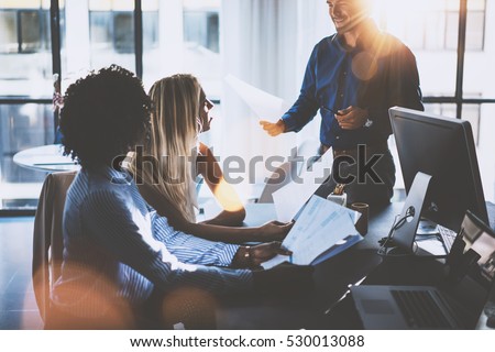 Foto stock: Young Team Of Coworkers Making Great Meeting Discussion In Modern Coworking Office Teamwork Process