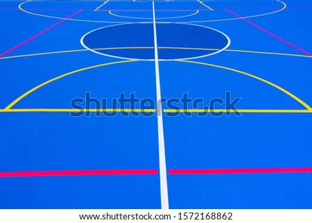 Stok fotoğraf: Red Lines Crossing A Floor Painted Blue Of Intense Color To Use As A Minimalist Design Background