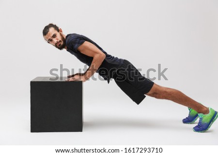 Сток-фото: Image Of Sportsman In Tracksuit Doing Push Ups From Black Workou