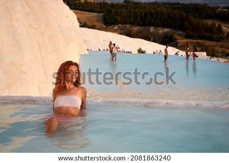 Stockfoto: Sexy Red Girl At The Swimming Pool