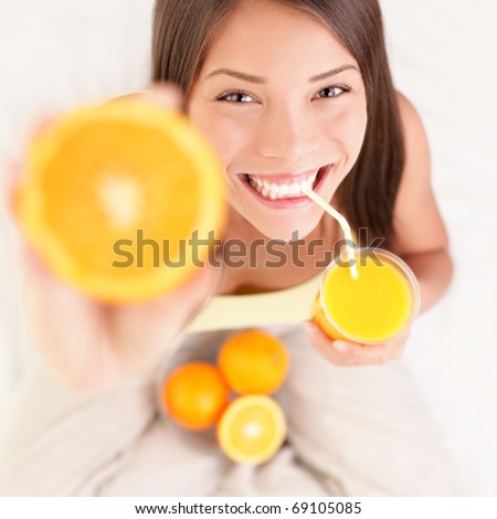 Chinese Woman Drinking Orange Juice Stock fotó © Ariwasabi